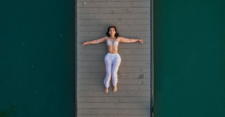 Self-Reflection - Birds Eye View of a Woman on the Pier