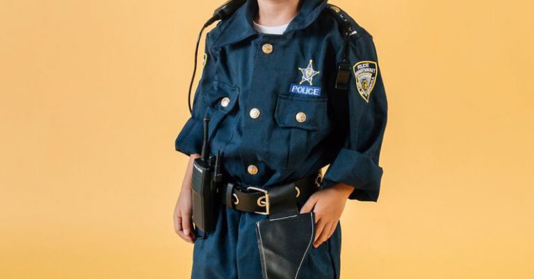 Career Goals - Asian child in policeman costume in studio