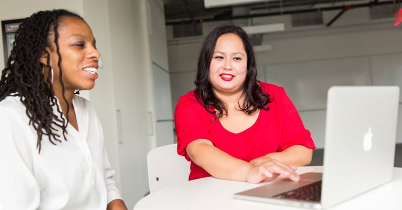 Mentor - Woman Wearing Red Top Holding Silver Macbook