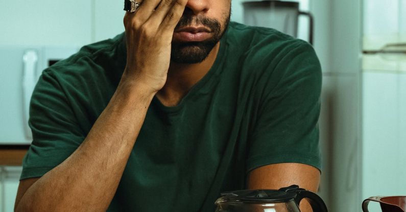 Problem-Solving - A man with glasses and a coffee cup in front of him