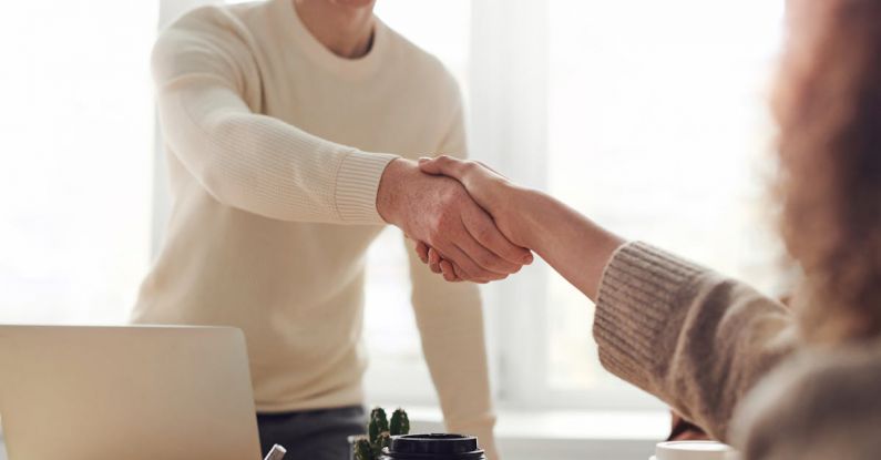 Interview - Man and Woman Near Table