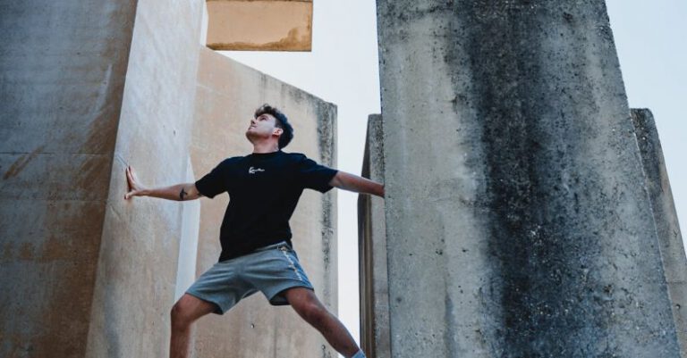 Scaling - Man Climbing a Building