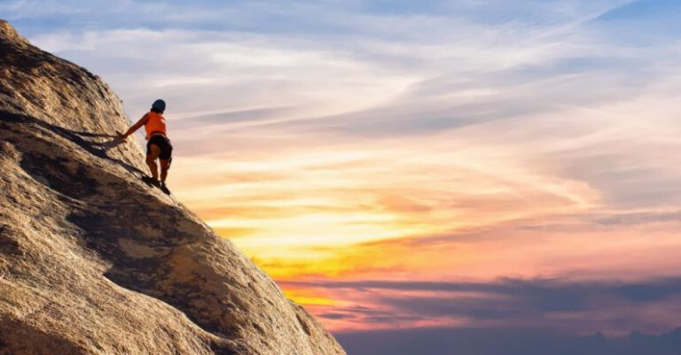 Challenges - Person Climbing on Mountain