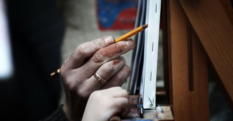 Skill Gaps - Close-up of an Elderly Person and Child Hands Drawing on Canvas