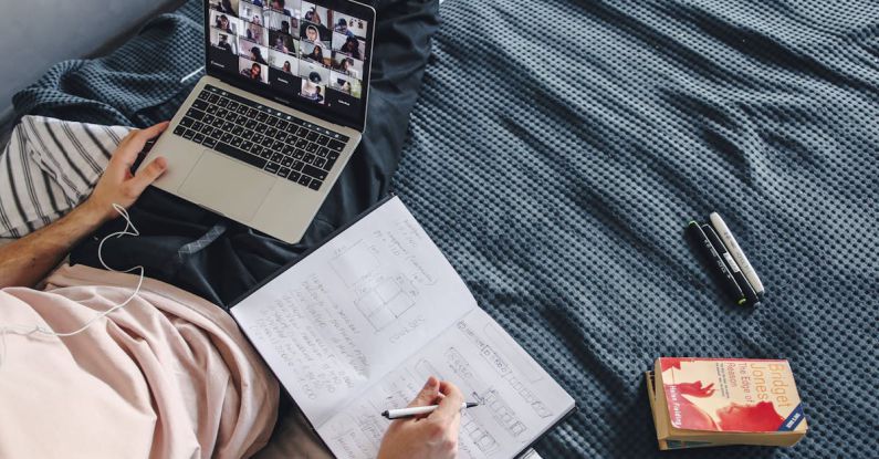 Online Courses - A Man Sitting on the Bed